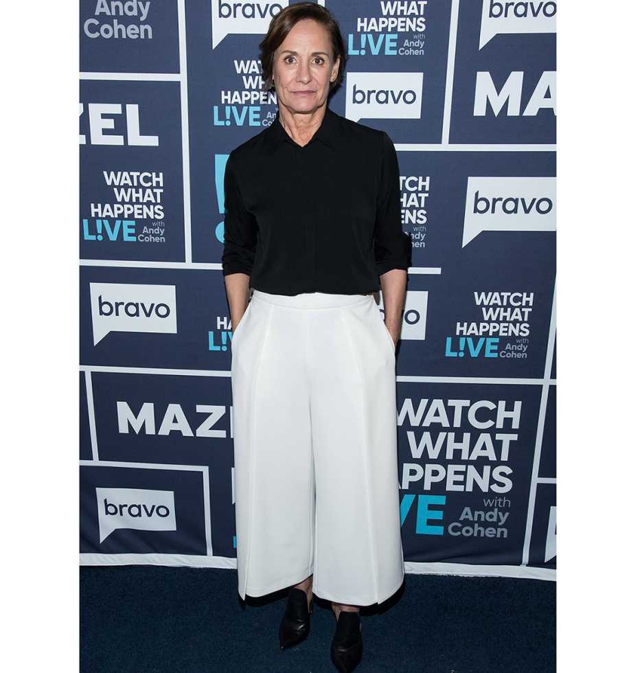 Laurie Metcalf wearing white wide pants.