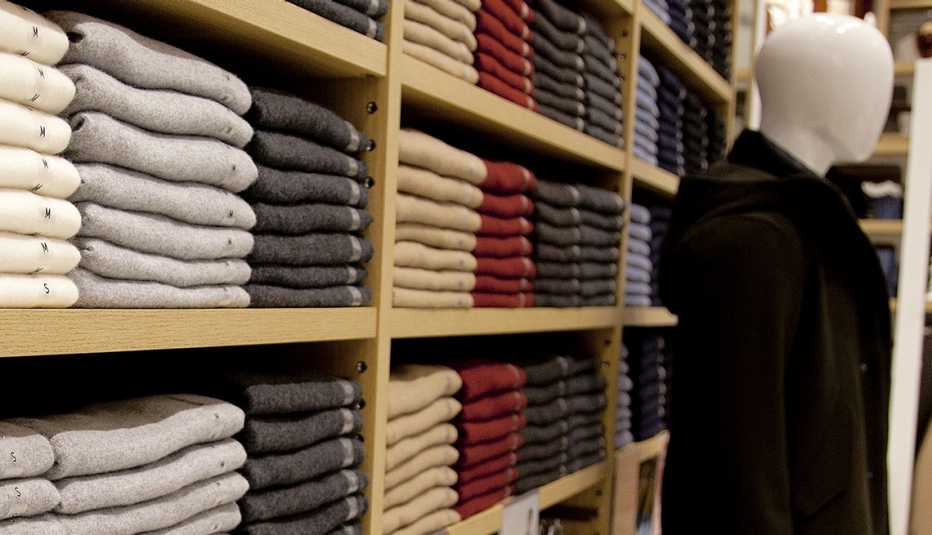 Cashmere clothes are displayed on shelves at Uniqlo