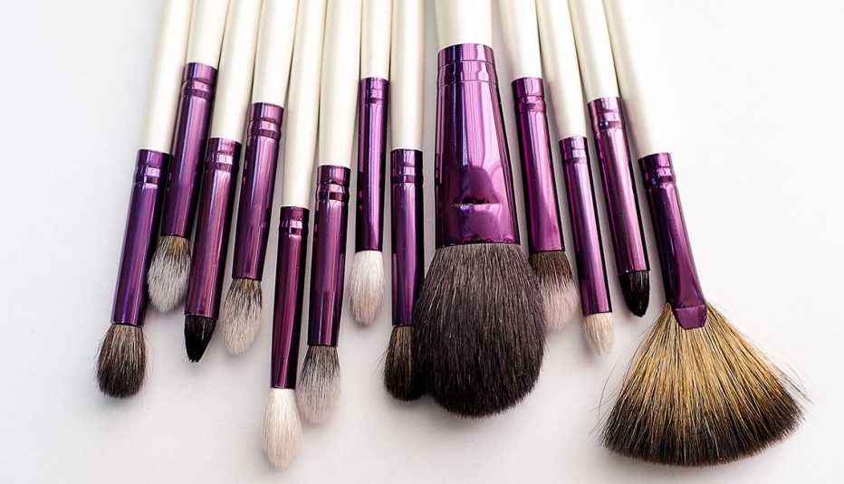 An assortment of makeup brushes on a white background