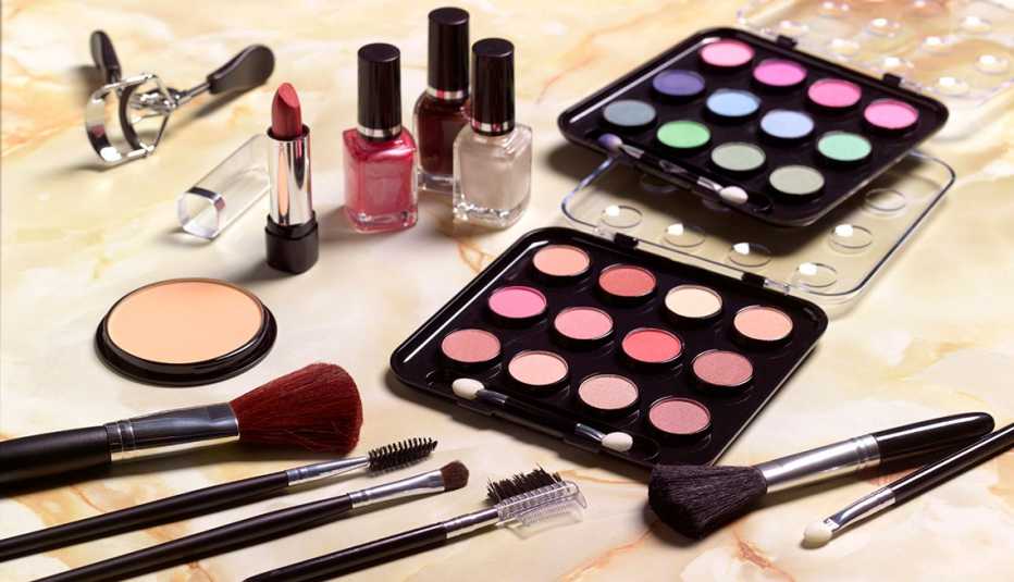 Assorted makeup and brushes on a table