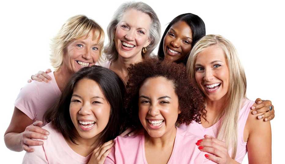 Happy group of diverse women embracing each other.