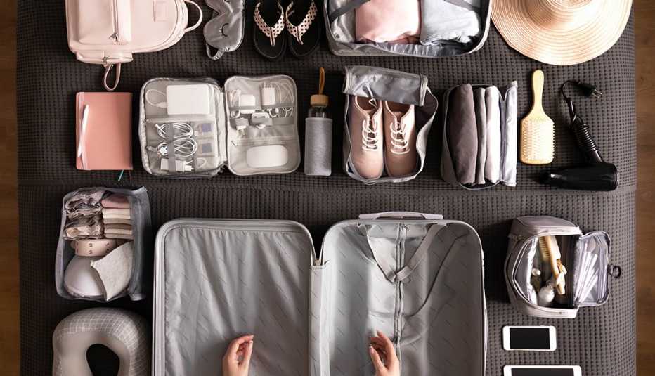 Woman getting ready to pack her suitcase