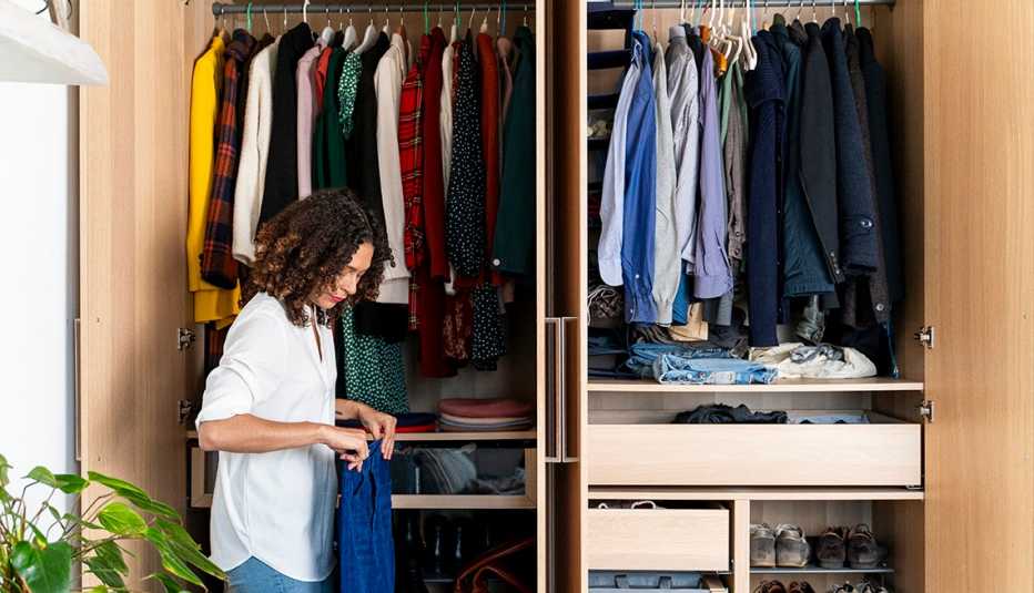 A woman organizing her wardrobe
