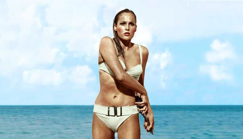 actress ursula andress in the ocean in a bikini during the film dr. no