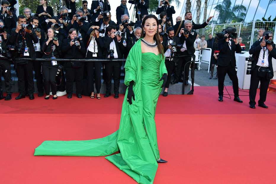 Michelle Yeoh wearing a green gown on the red carpet at the 76th annual Cannes film festival