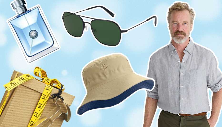 fathers day gift assortment of products including a button down lightweight summer shirt a floppy hat a pair of sunglasses and a bottle of cologne alongside a gift box wrapped with a hammer shaped cookie cutter and a measuring tape for a bow