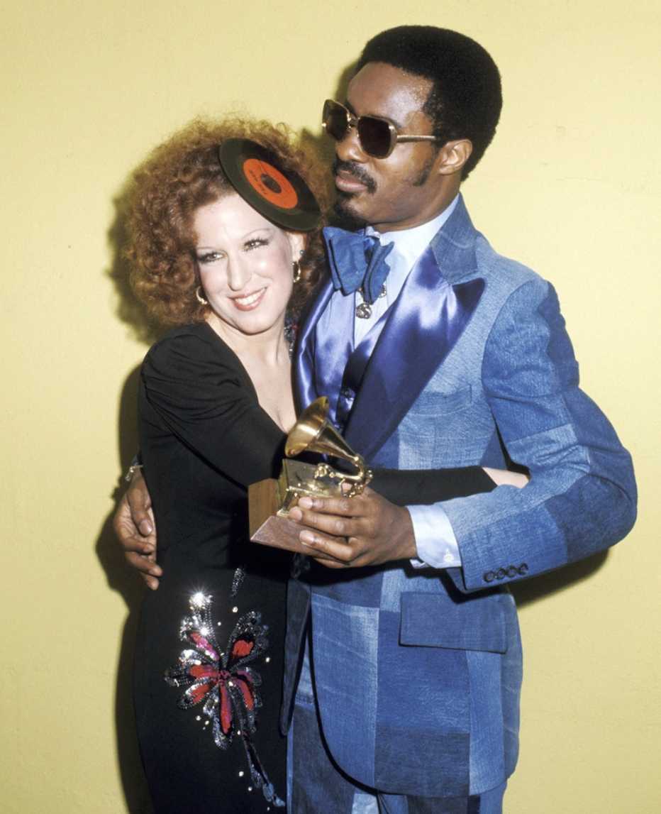 Bette Midler and Stevie Wonder hug at the 17th Annual Grammy Awards