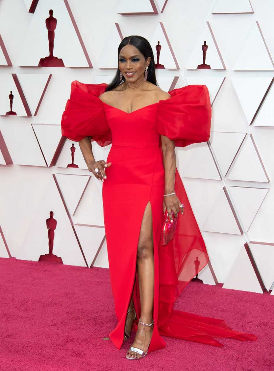 Angela Bassett wearing a red dress on the red carpet at the 93rd Annual Academy Awards