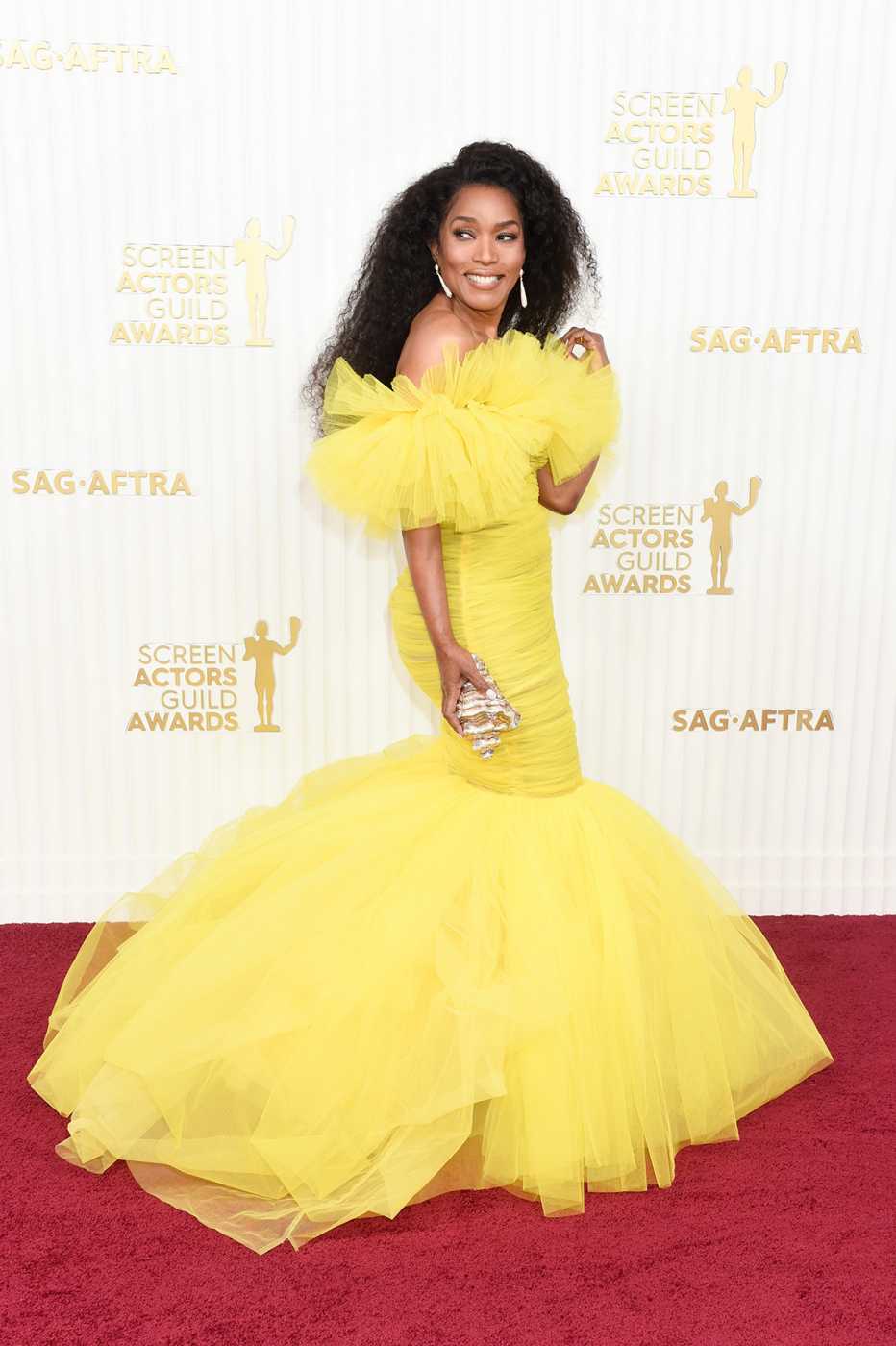 Angela Bassett wearing a yellow dress on the red carpet at the 29th Annual Screen Actors Guild Awards