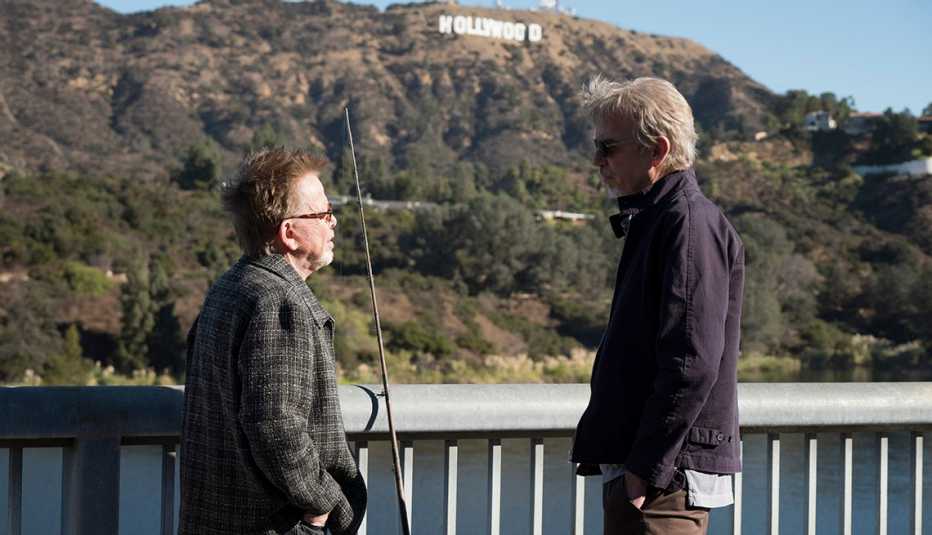 Paul Williams and Billy Bob Thornton standing in front of the Hollywood, California sign.