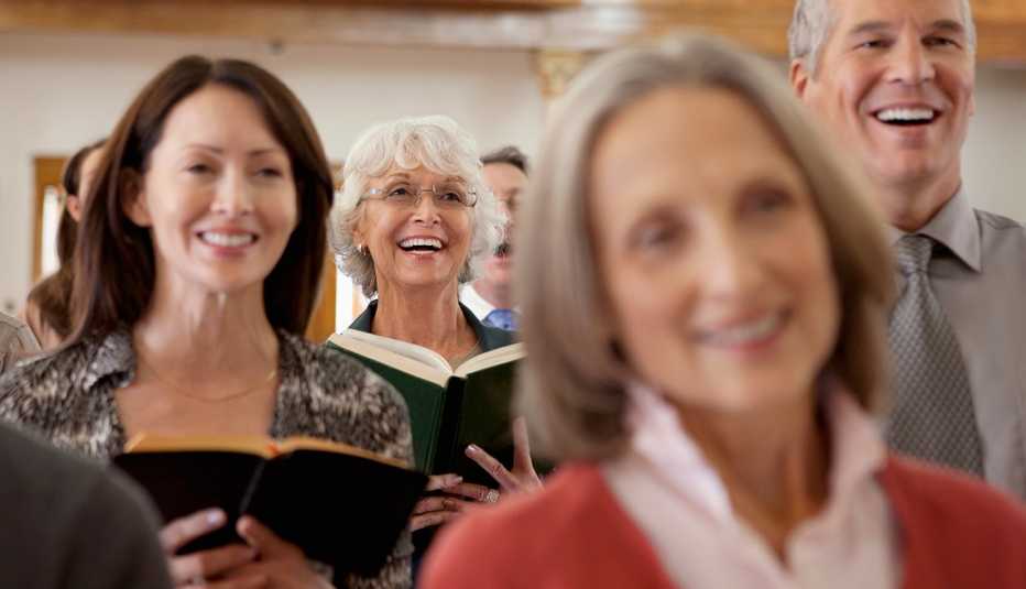 mature adults sing in a church 