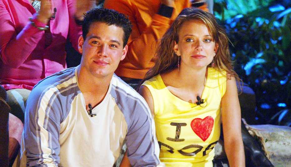 Survivor All Stars cast members Boston Rob Mariano and Amber Brkich sitting next to each other during the season finale