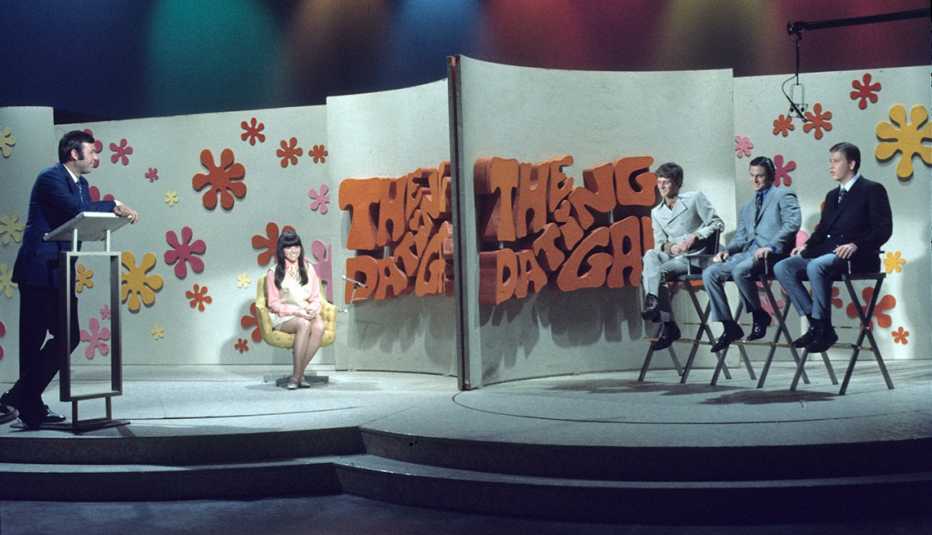 Host Jim Lange with the contestants on The Dating Game