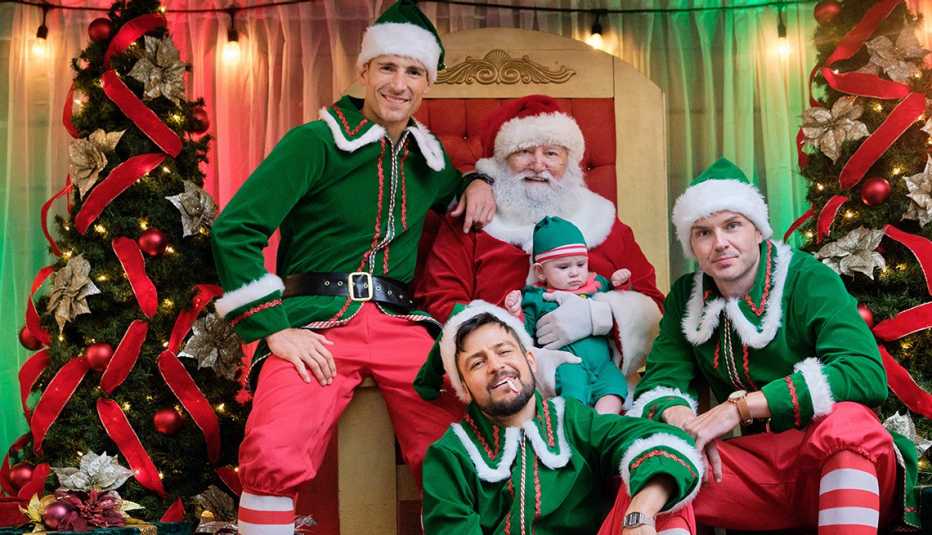 Andrew Walker, Tyler Hynes and Paul Campbell with Santa Claus and a baby in Hallmark Channel's Three Wise Men and a Baby