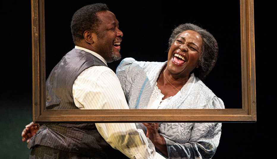 Wendell Pierce and Sharon D Clarke laughing together in a performance of Death of a Salesman at the Piccadilly theatre in London