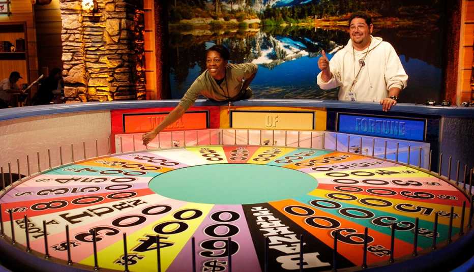 Two contestants on Wheel of Fortune