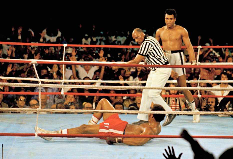 Muhammad Ali knocks down George Foreman during their historic Rumble in the Jungle match in 1974
