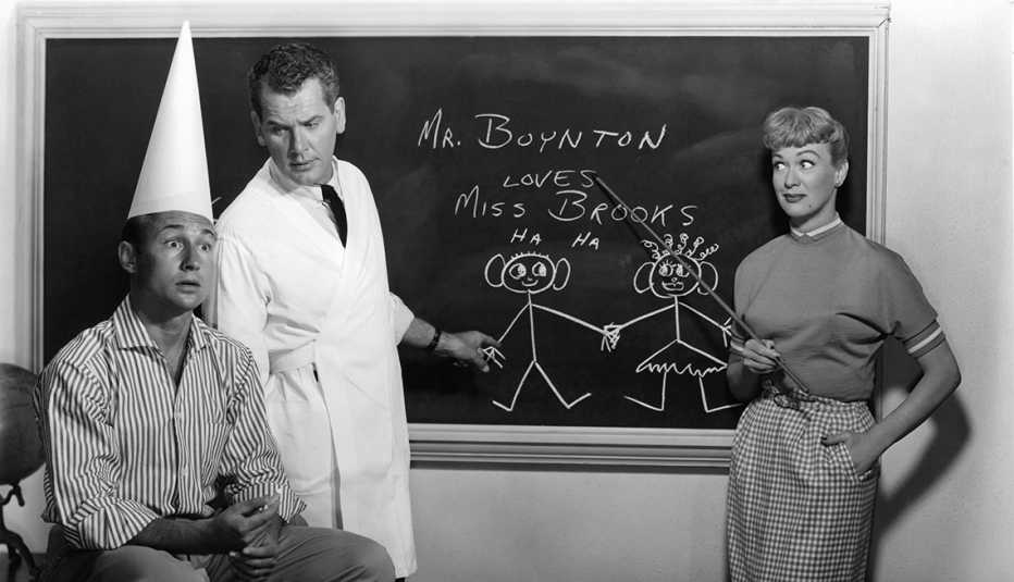 Nick Adams, Robert Rockwell and Eve Arden stand in front of a chalkboard in Our Miss Brooks