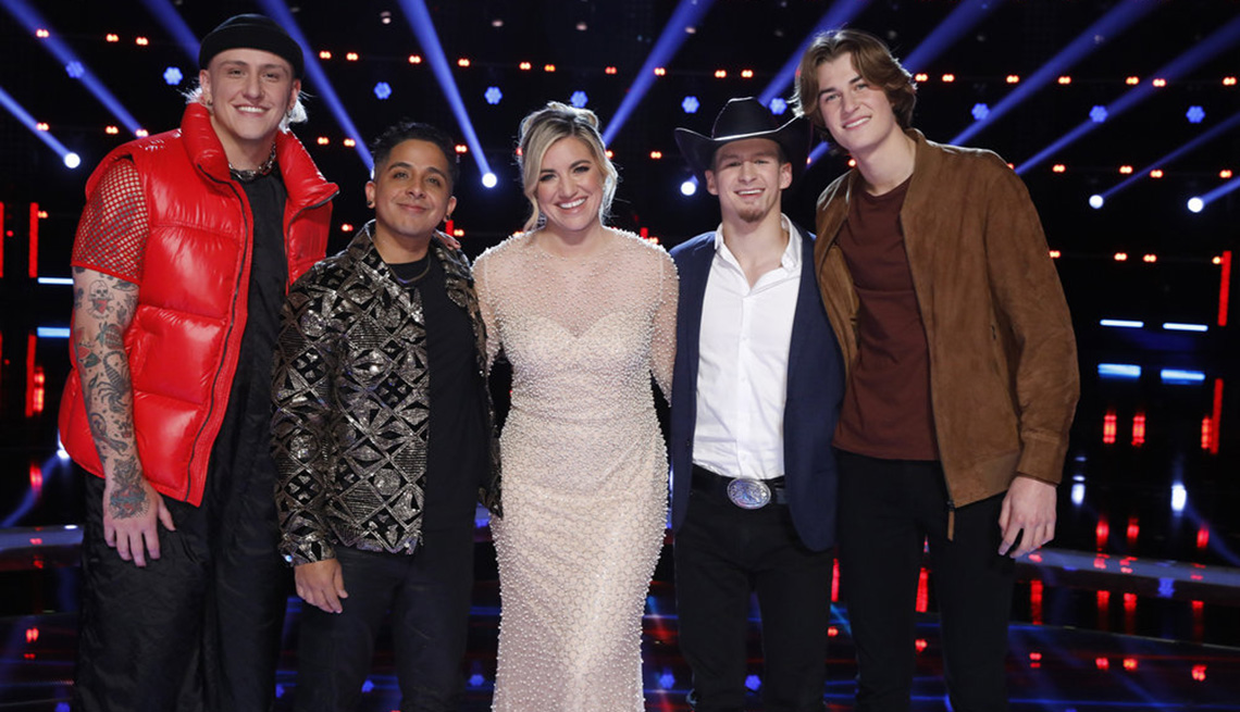 The Voice Season 22 finalists Bodie, Omar Jose Cardona, Morgan Myles, Bryce Leatherwood and Brayden Lape pose for a photo together on stage
