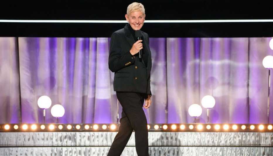 Ellen DeGeneres speaking onstage during the NBC special Carol Burnett: 90 Years of Laughter and Love
