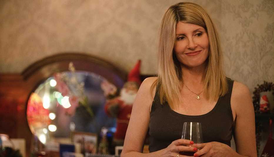 sharon horgan smiles while holding a wine glass in the apple tv plus series bad sisters
