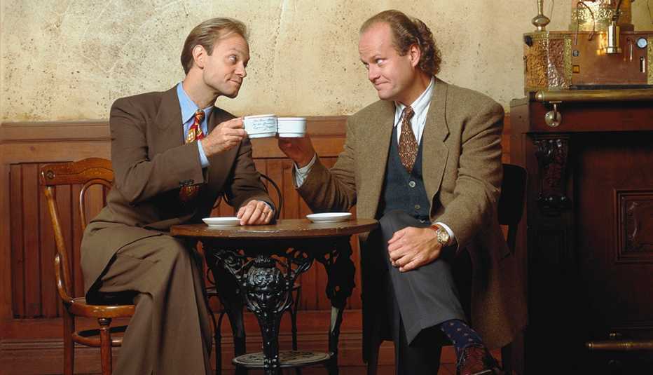 david hyde pierce and kelsey grammer press their coffee cups together in a promotional photo for the nbc series frasier