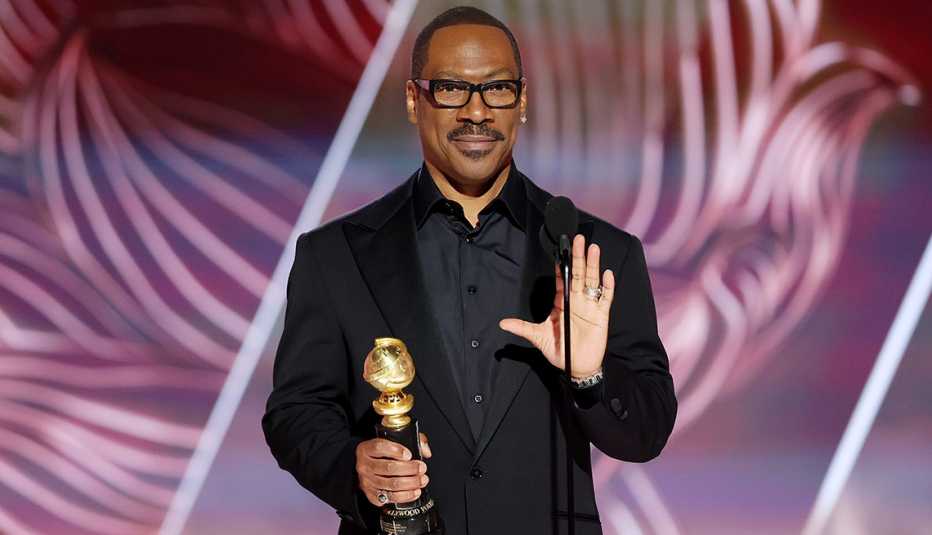 Eddie Murphy speaking onstage after accepting the Cecil B. DeMille Award at the 80th Annual Golden Globe Awards