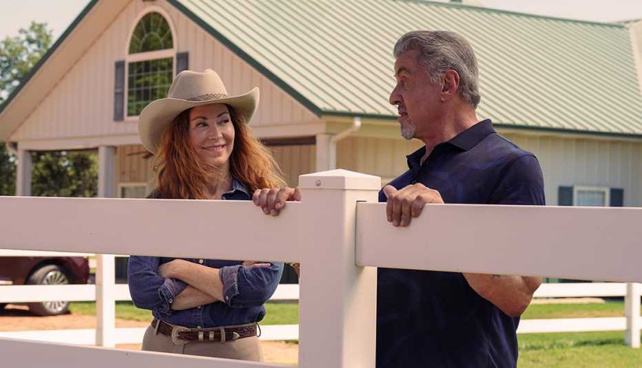 Dana Delany and Sylvester Stallone talking to each other outside in a scene from the Paramount Plus series Tulsa King