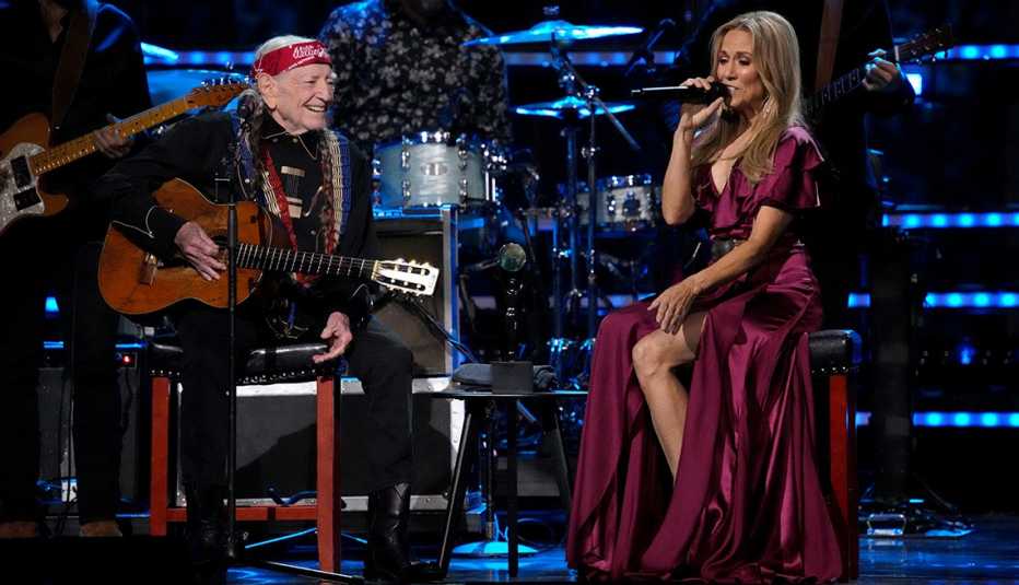 Willie Nelson and Sheryl Crow performing together at the 38th Annual Rock & Roll Hall of Fame Induction Ceremony.