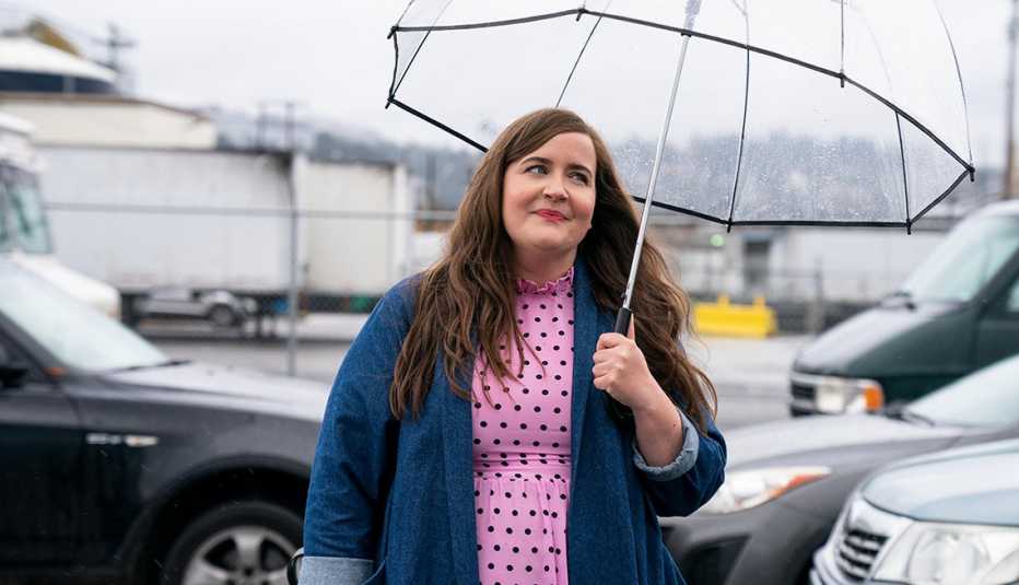 Aidy Bryant holds an umbrella in a scene from the Hulu series Shrill