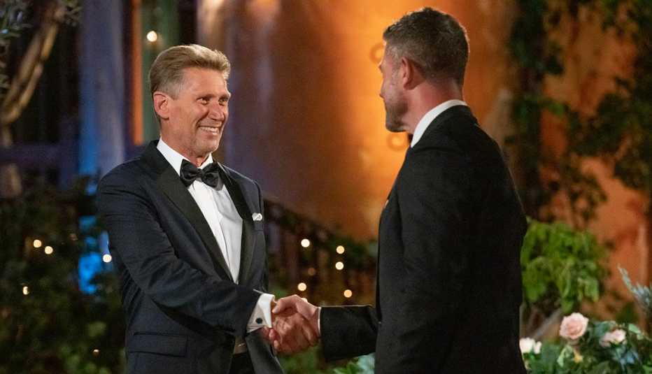the golden bachelor gerry turner shakes hands with host jesse palmer