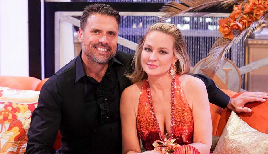 Joshua Morrow and Sharon Case sitting next to each other in The Young and the Restless