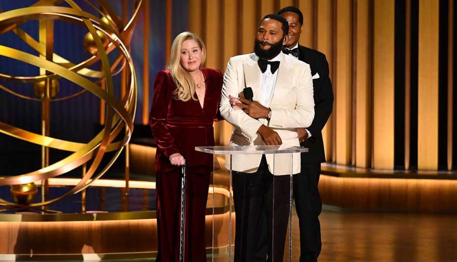 Christina Applegate onstage with host Anthony Anderson at the 75th Emmy Awards