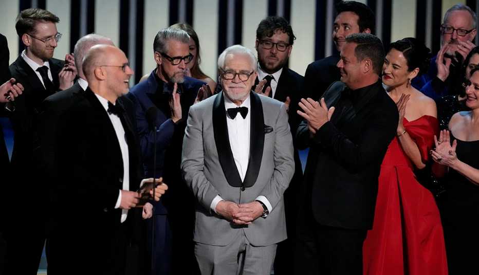 The cast and crew of "Succession" accept the outstanding drama series award at the 75th Emmy Awards