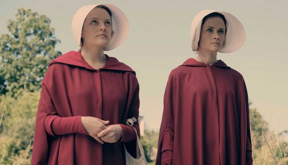 left elisabeth moss right alexis bledel in the handmaids tale