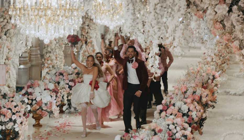 Jennifer Lopez dancing with the bridal party in a wedding scene for "This Is Me ... Now."