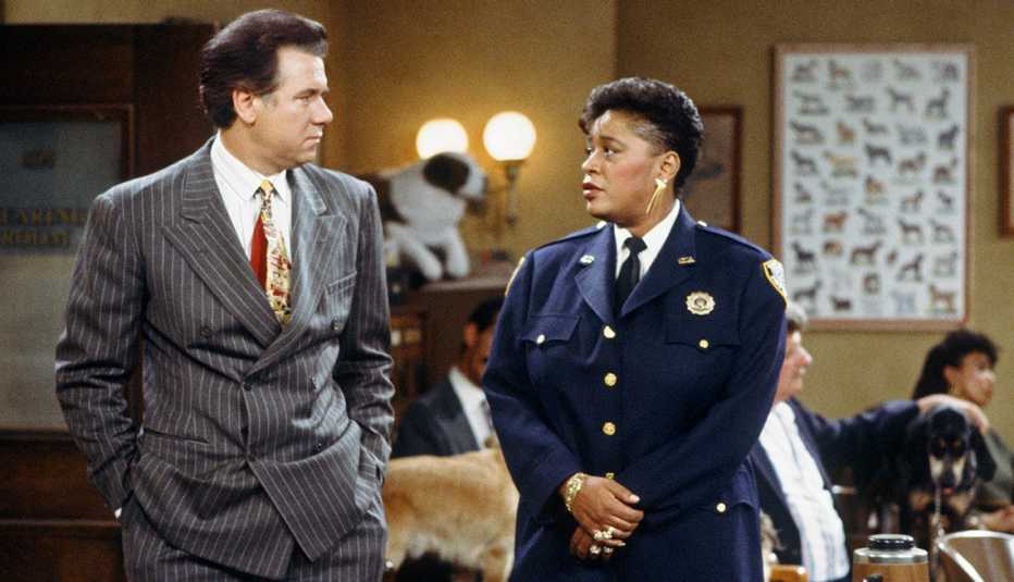 John Larroquette and Marsha Warfield talking to each other in the original "Night Court" series.