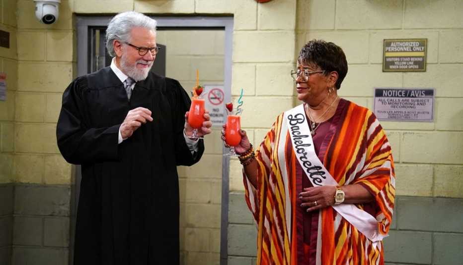 John Larroquette and Marsha Warfield holding cocktails in "Night Court."