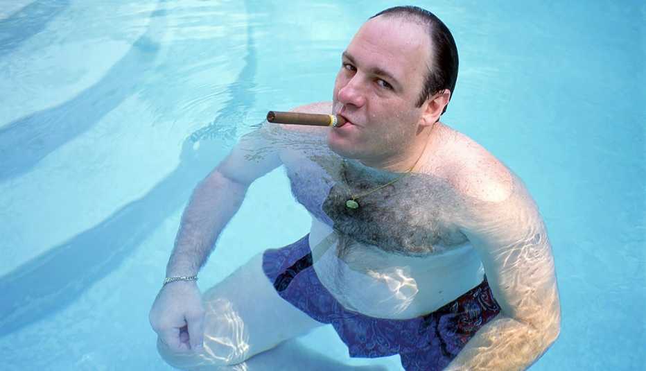 james gandolfini as tony soprano in a swimming pool smoking a cigar in the sopranos