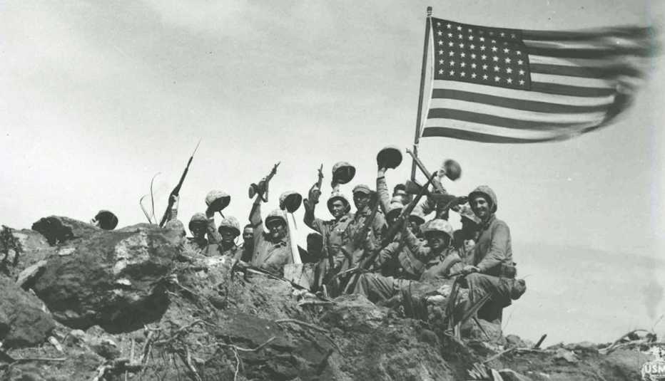 Marines raise the American flag on Mount Suribachi after the Battle of Iwo Jima. 