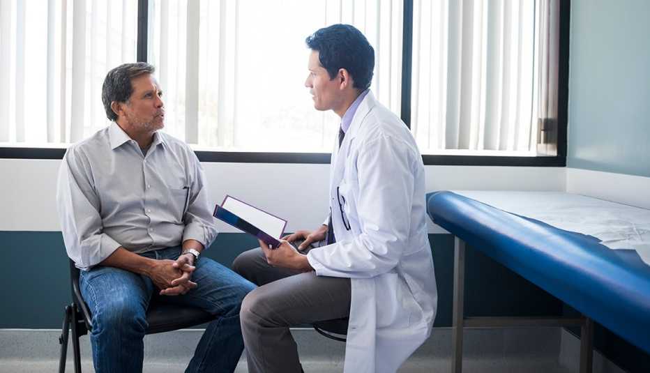 a doctor explains something to a patient