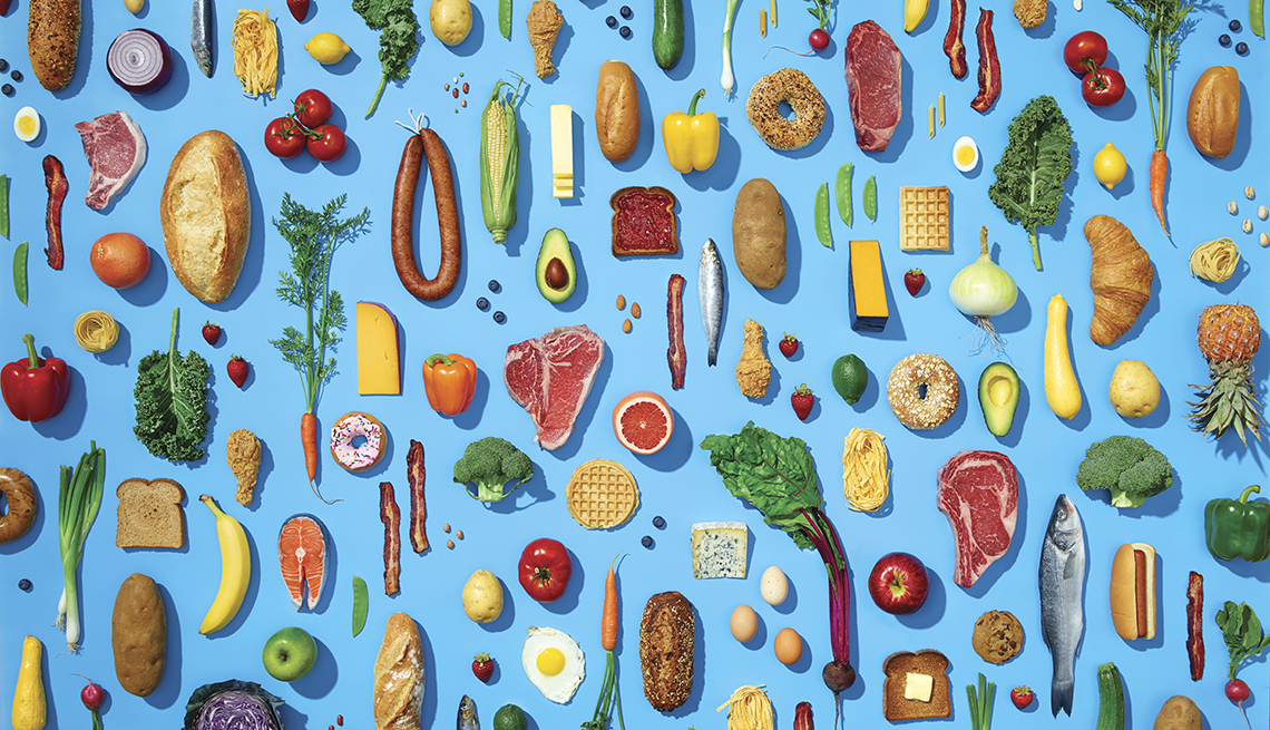 Various healthy foods in pattern on blue