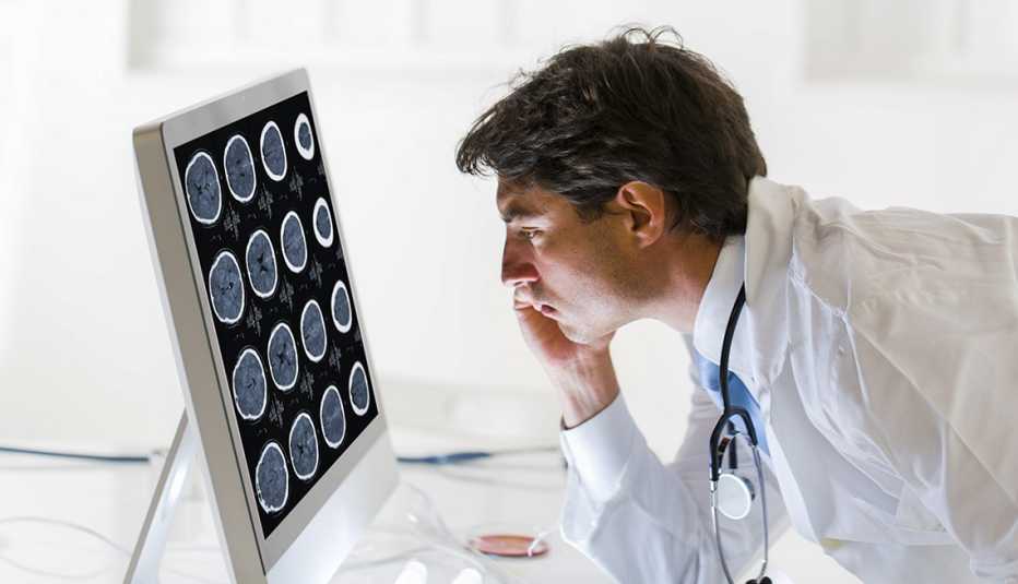 Doctor looking at scan of human brain
