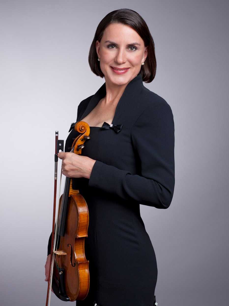 Musician portrait of Alison Dalton holding her violin.