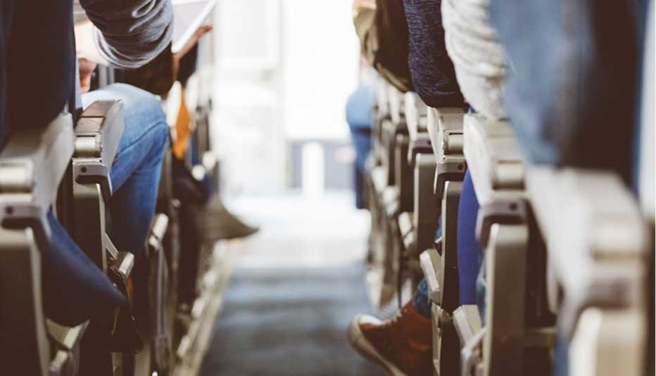 Airplane seats with passengers sitting