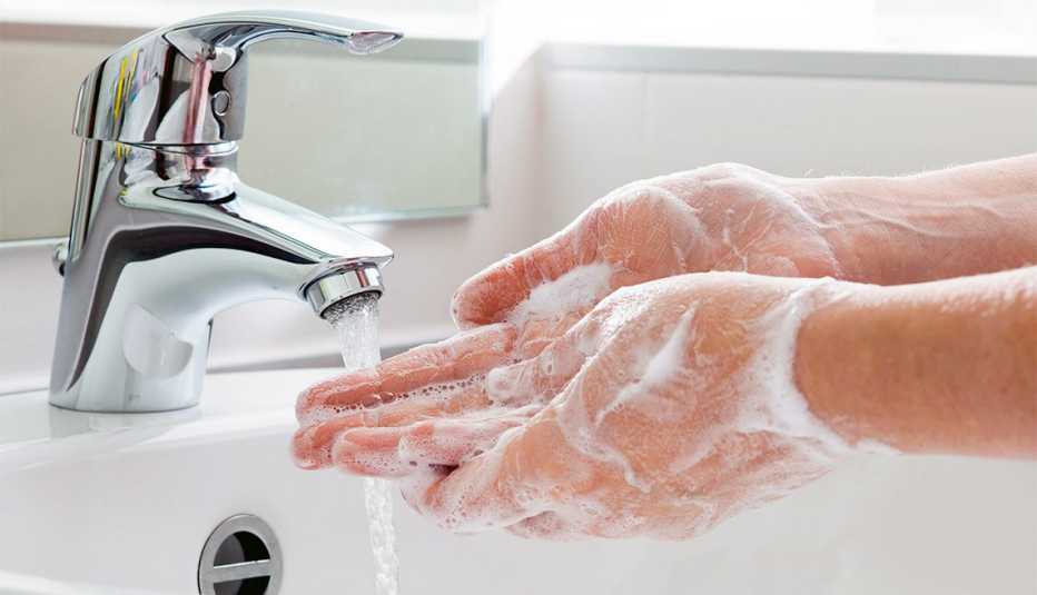 Washing hands to avoid flu germs.