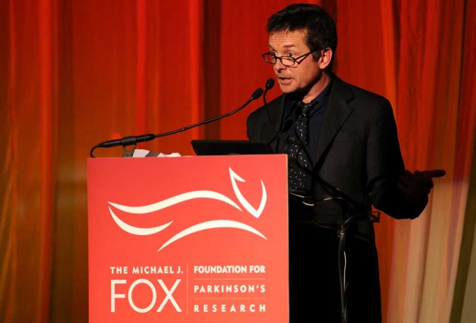 Michael J Fox speaking at a confrence for parkinson research