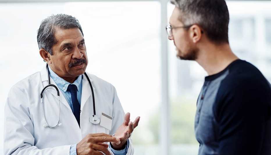 Male doctor and male patient talking