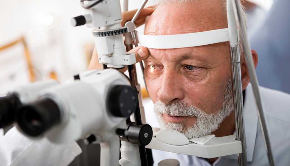 Ophthalmologist checking patient's eyes