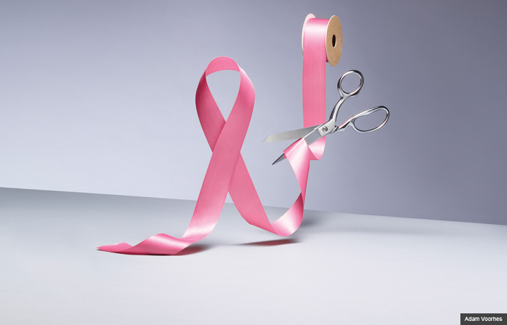 pink ribbon being cut by scissors (Adam Voorhes)
